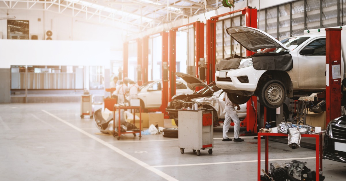 lesterbuildingsystemsllc-470705-car-repair-shop-imagea.jpg A commercial auto repair shop features vehicle lifts, service bays, mechanics, and open floor space for maintenance. File Name: lesterbuildingsystemsllc-470705-car-repair-shop-im